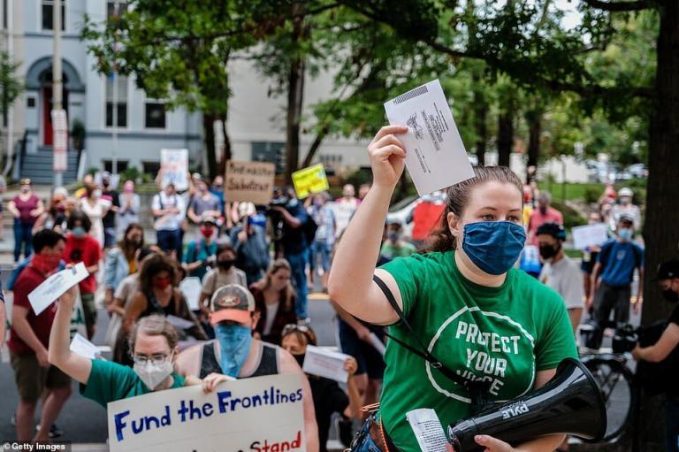 Protesters Gather Outside of Postmaster General’s Home